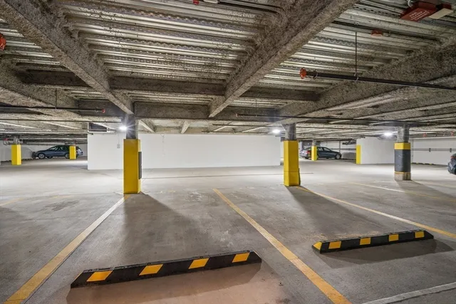 a view of parking garage with cars