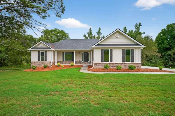a front view of a house with a yard