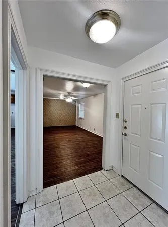 a view of an empty room with a window