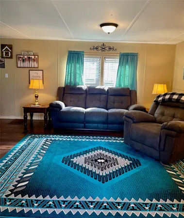 a living room with a couch and a rug