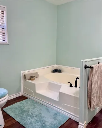 a bedroom with a bed and lamps