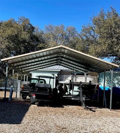 a view of a car park in front of the house