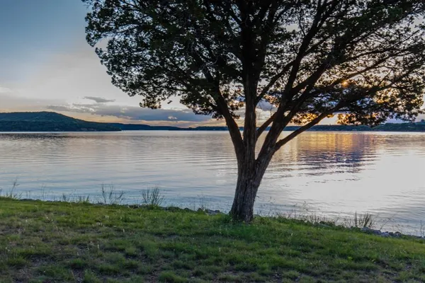 a view of a lake from a yard