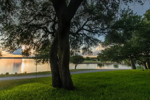 a view of lake with a yard
