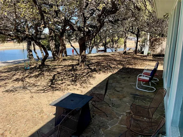 a view of a backyard with sitting area