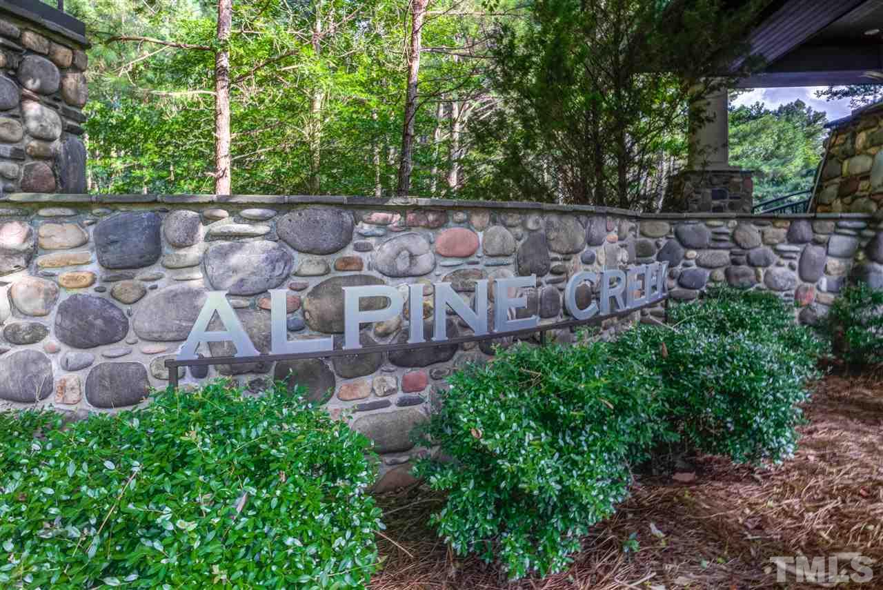 5801 Creek Pointe Way Raleigh, NC 27614 - Photo 3 of 8 a view of a yard with plants and large trees