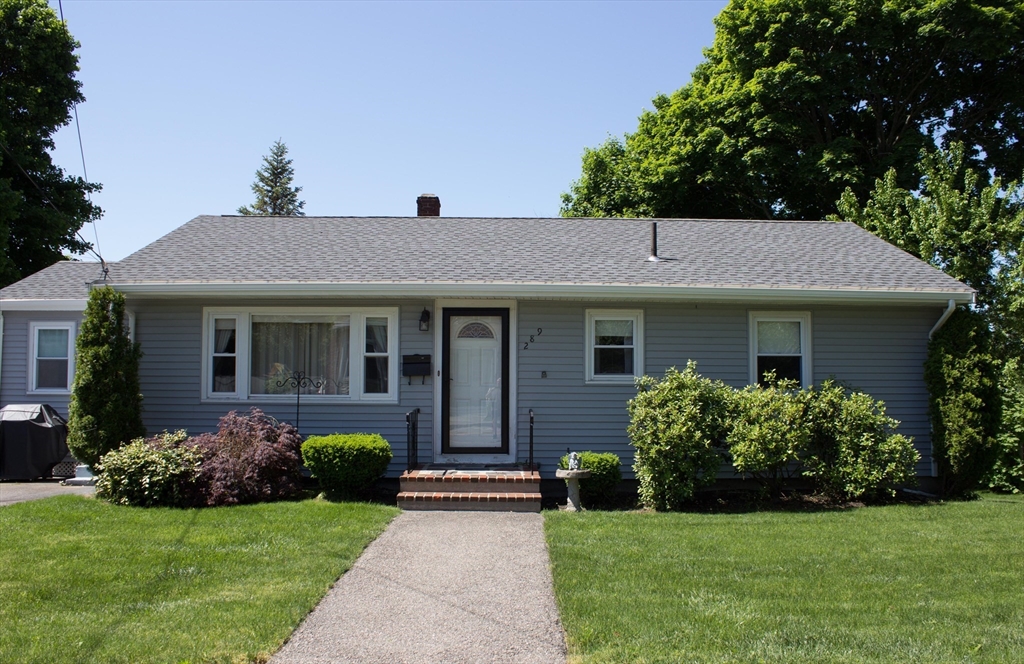 289 Winter Street Brockton, MA 02302 - Photo 1 of 27 a front view of a house with a garden