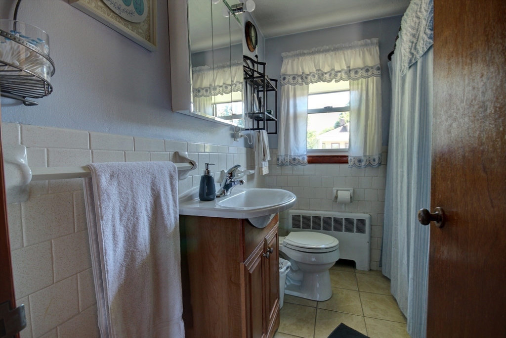 289 Winter Street Brockton, MA 02302 - Photo 20 of 27 a bathroom with a sink toilet and shower