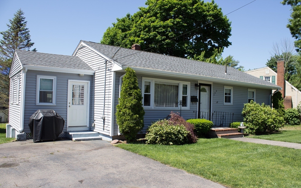 289 Winter Street Brockton, MA 02302 - Photo 2 of 27 a view of a house with garden and yard
