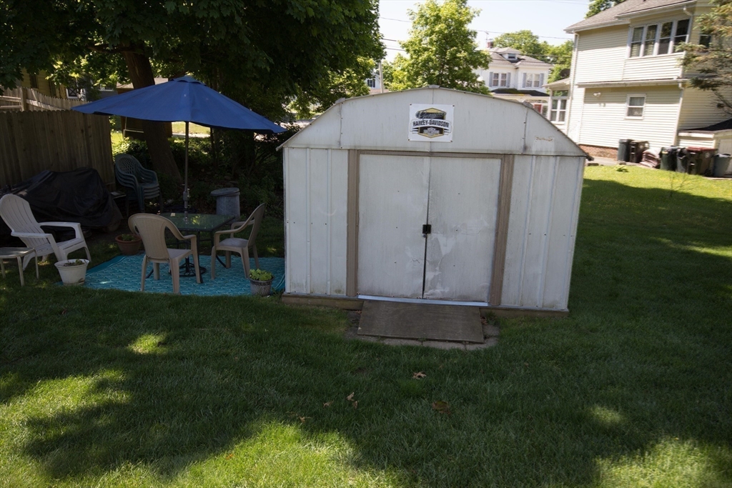 289 Winter Street Brockton, MA 02302 - Photo 25 of 27 a view of a table and chairs in backyard