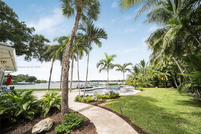 a kitchen with stainless steel appliances a refrigerator stove and microwave
