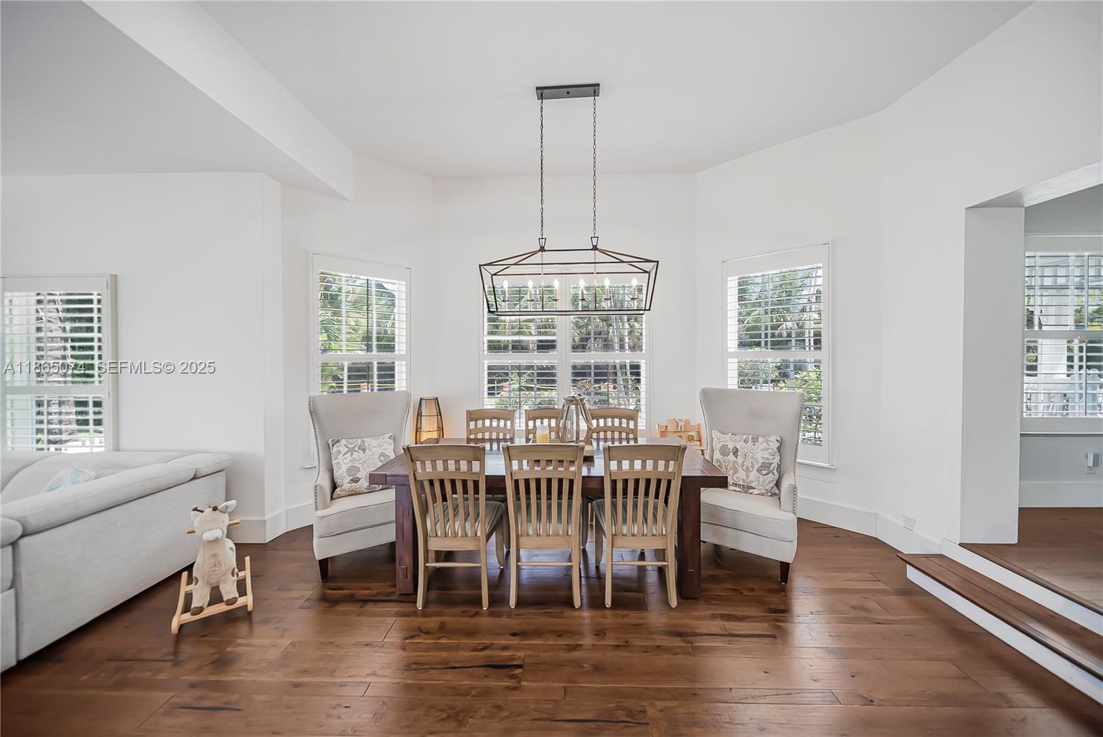 1020 Lands End Way Jupiter, FL 33458 - Photo 15 of 79 a view of a dining room with furniture window and wooden floor