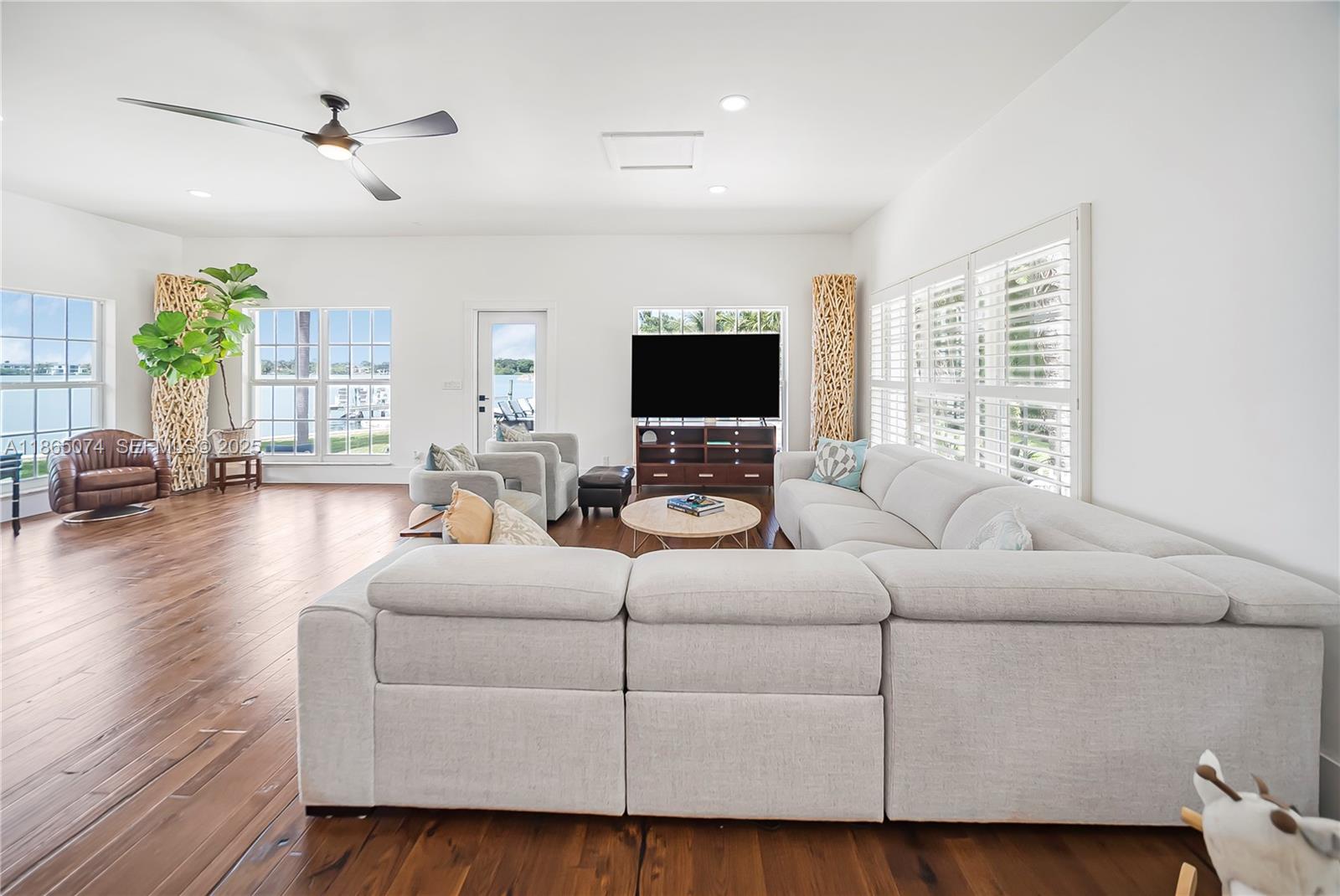 1020 Lands End Way Jupiter, FL 33458 - Photo 25 of 79 a living room with furniture and a flat screen tv