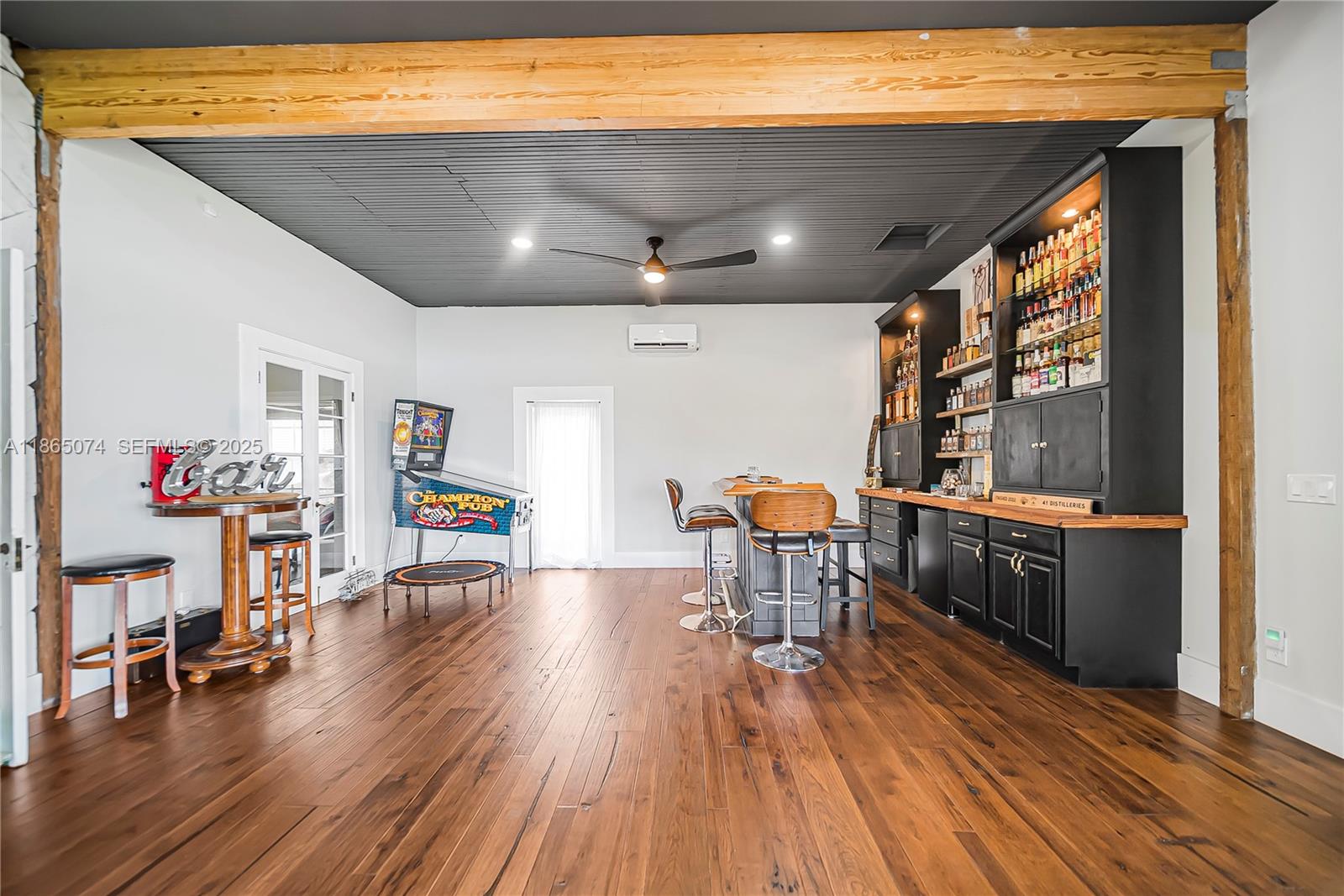 1020 Lands End Way Jupiter, FL 33458 - Photo 34 of 79 a living room with furniture and a wooden floor