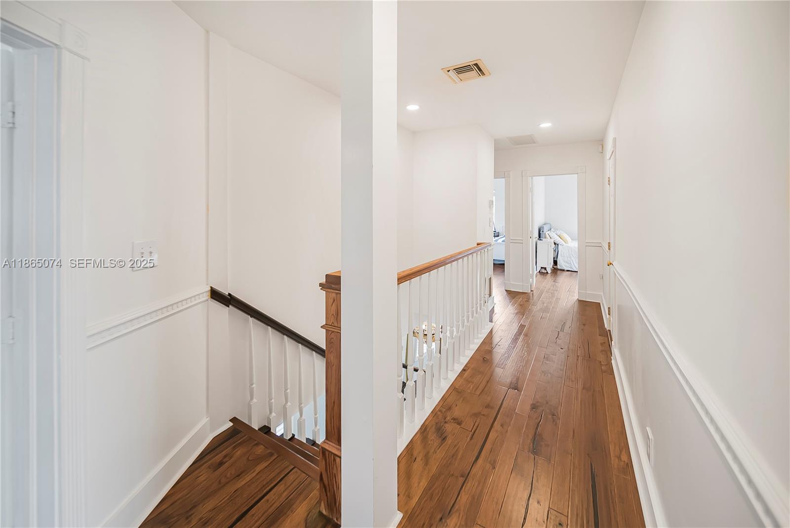 1020 Lands End Way Jupiter, FL 33458 - Photo 40 of 79 a view of a hallway with wooden floor and staircase