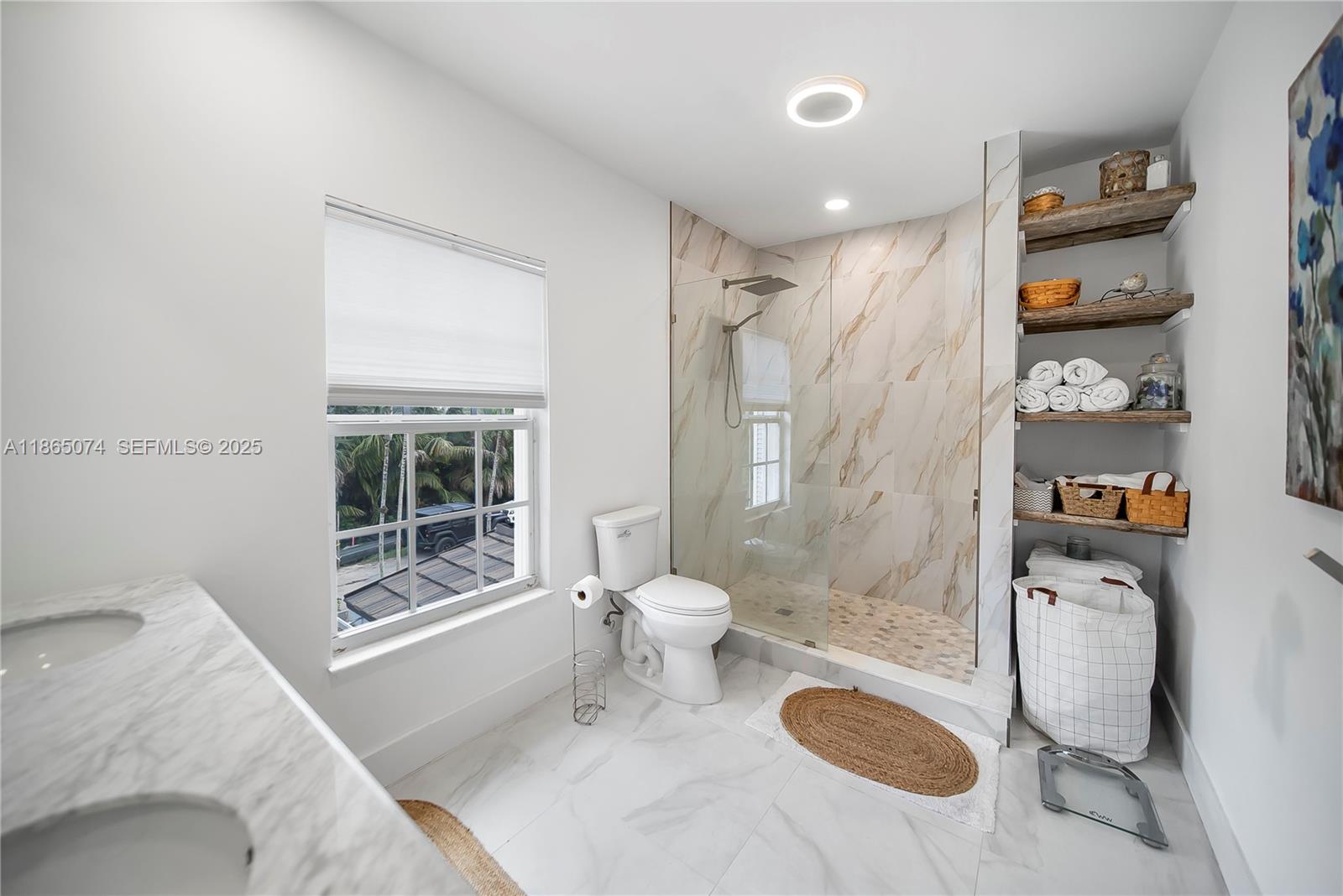 1020 Lands End Way Jupiter, FL 33458 - Photo 59 of 79 a bathroom with a sink toilet and shower