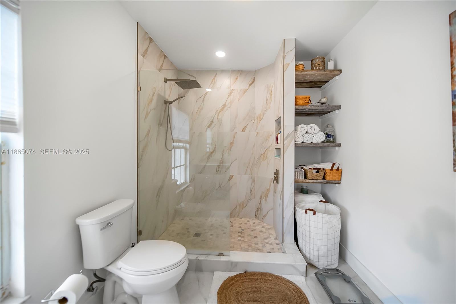 1020 Lands End Way Jupiter, FL 33458 - Photo 60 of 79 a bathroom with a toilet and a shower