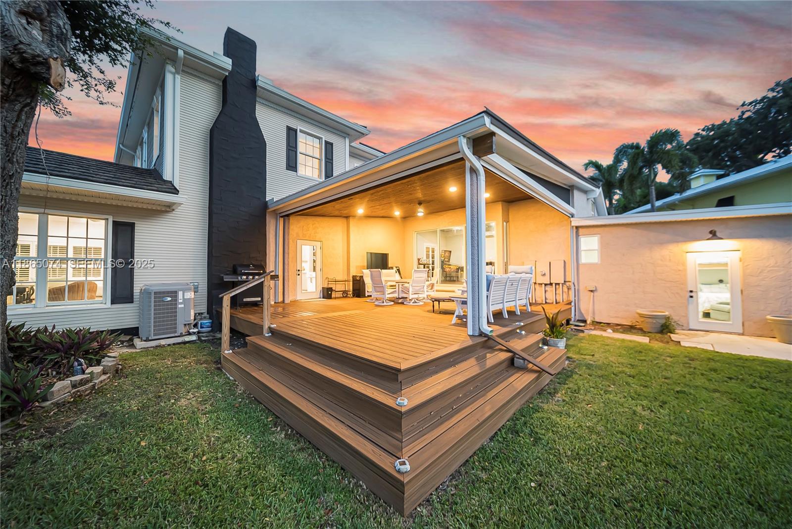 1020 Lands End Way Jupiter, FL 33458 - Photo 65 of 79 a view of a house with a backyard and patio