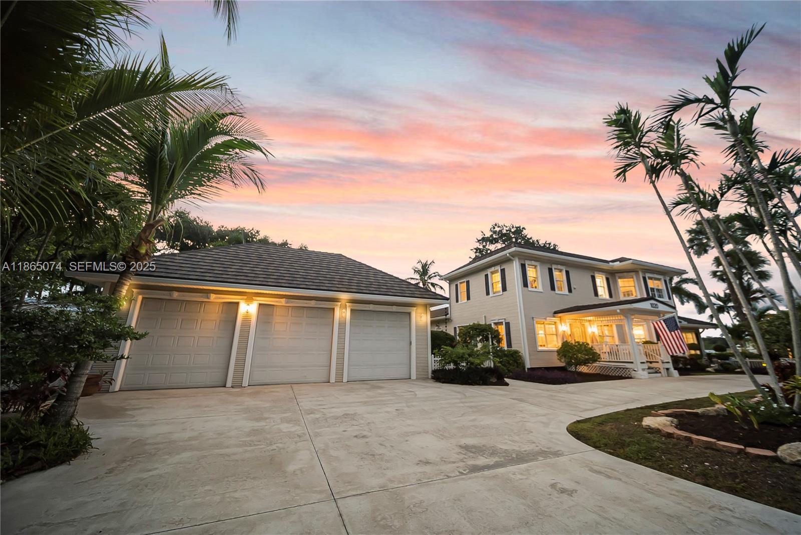 1020 Lands End Way Jupiter, FL 33458 - Photo 7 of 79 a front view of a house with a yard and garage