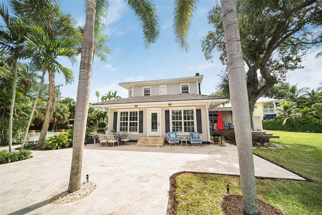 a kitchen with stainless steel appliances granite countertop a stove and wooden floors