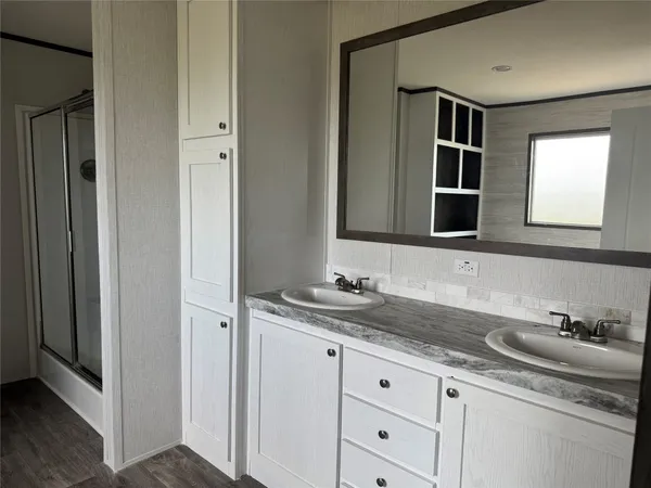 a bathroom with a sink and a mirror