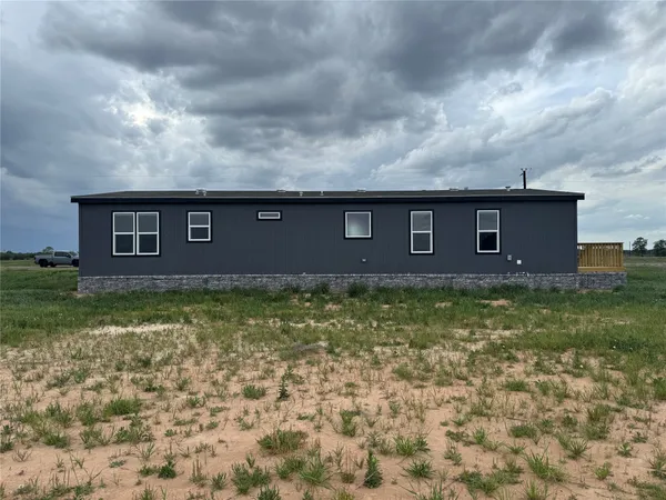 a brick building with a yard