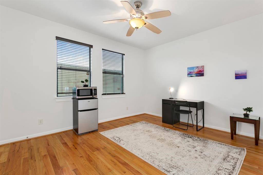 1841 Radcliffe Street Houston, TX 77007 - Photo 14 of 31 a bedroom with a bed and a table in it