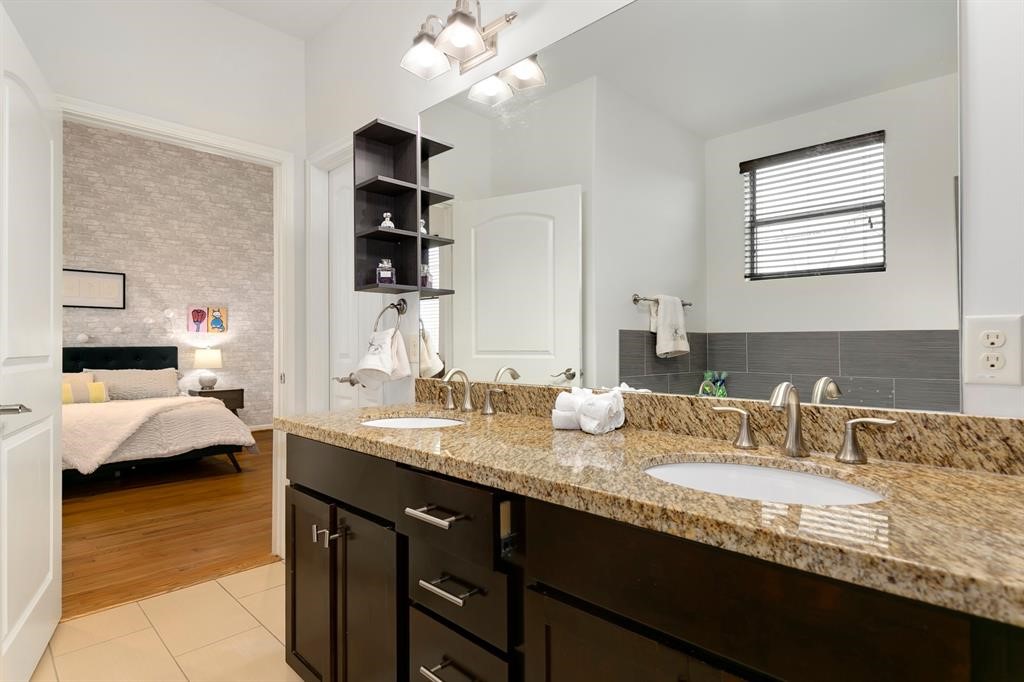 1841 Radcliffe Street Houston, TX 77007 - Photo 21 of 31 a bathroom with a granite countertop double vanity sink and a mirror
