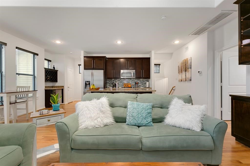 1841 Radcliffe Street Houston, TX 77007 - Photo 4 of 31 a living room with furniture and a view of kitchen