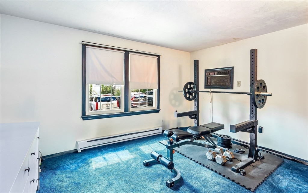 30 Pope Street, Unit A Hudson, MA 01749 - Photo 6 of 9 a view of workspace with a window and gym equipment