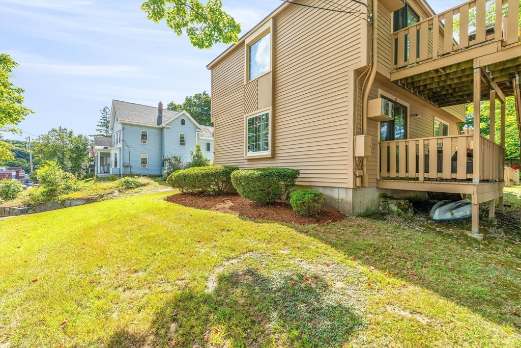 30 Pope Street, Unit A Hudson, MA 01749 - Photo 9 of 9 a view of residential house with swimming pool
