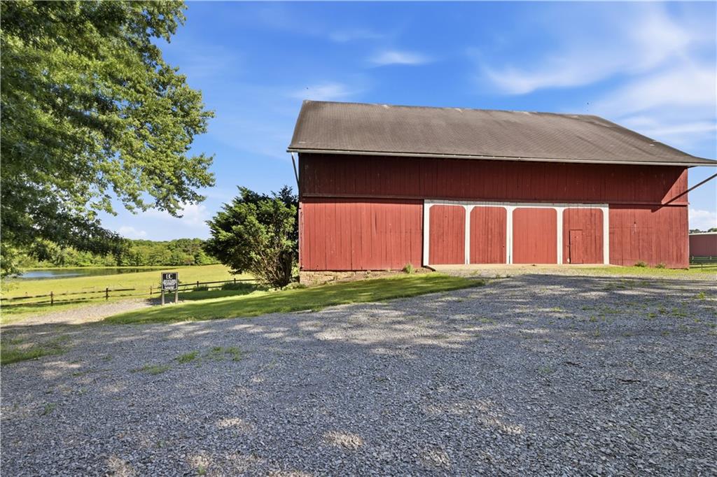 121 Brewer Road Saxonburg, PA 16056 - Photo 46 of 49 a view of a house with a yard and garage