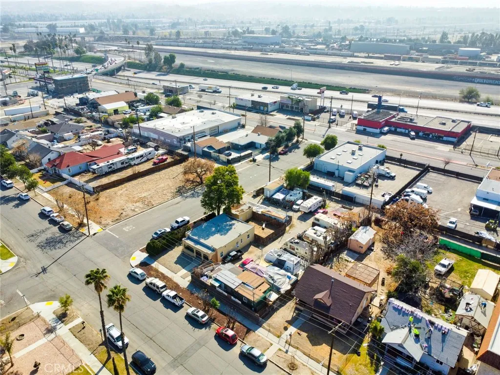 584 East H Street Colton, CA 92324 - Photo 11 of 18 an aerial view of a house with a lake view