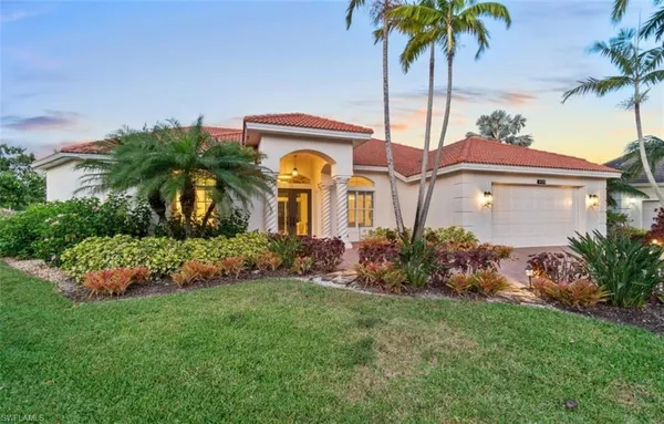 a front view of house with garden