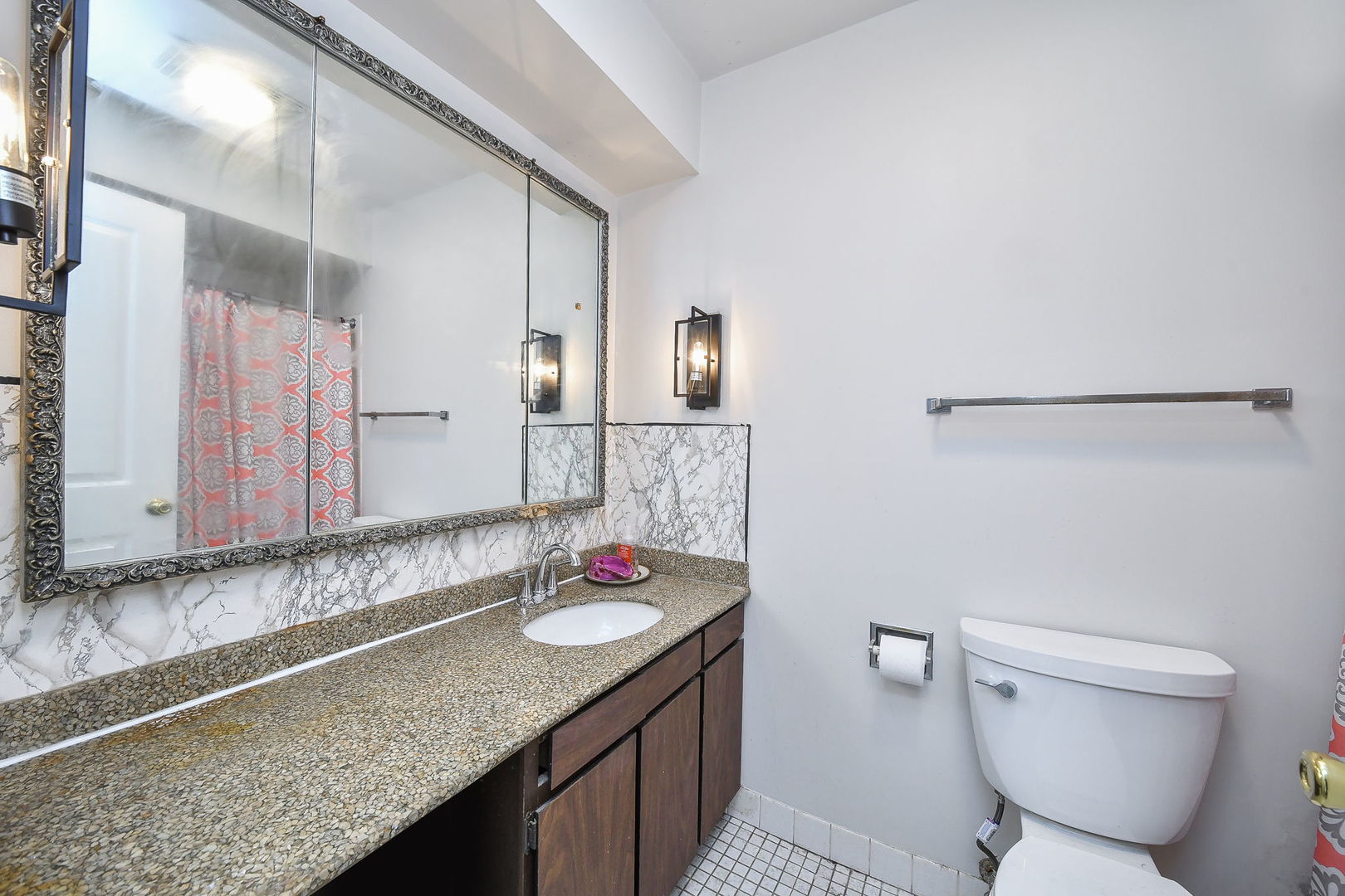 478 Raintree Court, Unit 2B Glen Ellyn, IL 60137 - Photo 6 of 16 a bathroom with a granite countertop sink and a mirror