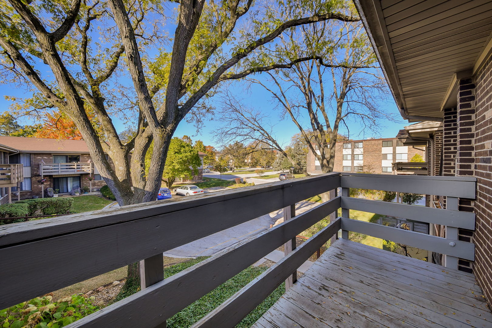 478 Raintree Court, Unit 2B Glen Ellyn, IL 60137 - Photo 10 of 16 a view of a house with a yard