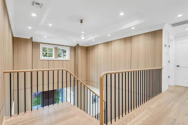 a bedroom with a large bed and a large window
