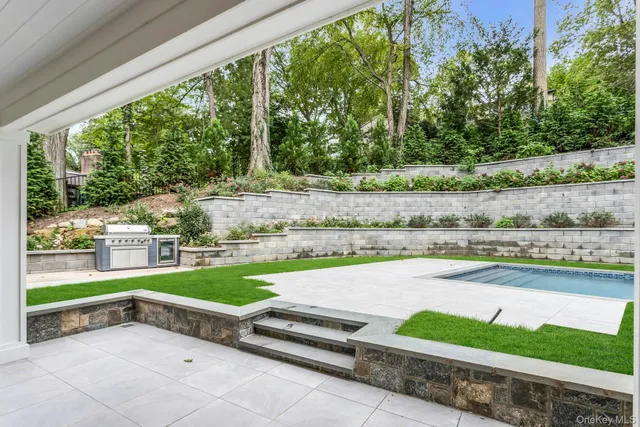 a view of a backyard with a small pool