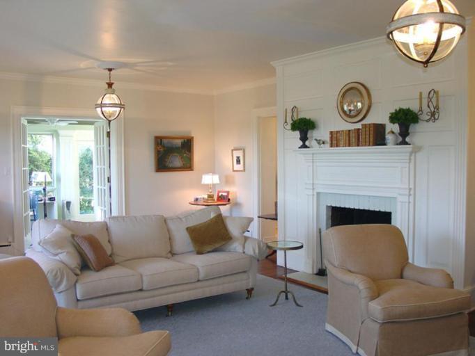 40694 Farm Market Road Leesburg, VA 20176 - Photo 14 of 30 a living room with furniture and a fireplace
