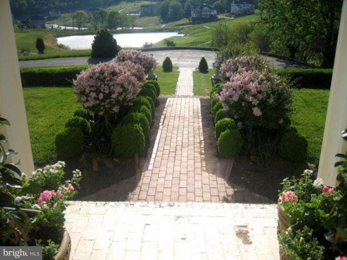 40694 Farm Market Road Leesburg, VA 20176 - Photo 19 of 30 a view of a garden with pathway
