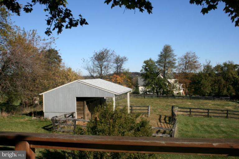 40694 Farm Market Road Leesburg, VA 20176 - Photo 22 of 30 an aerial view of a house with garden space and trees