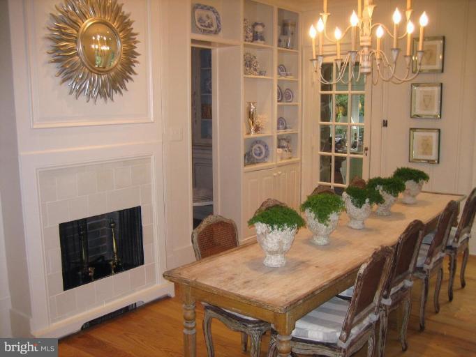 40694 Farm Market Road Leesburg, VA 20176 - Photo 27 of 30 a dining room with furniture potted plants and wooden floor
