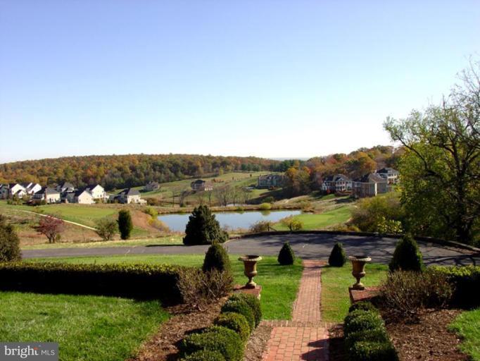 40694 Farm Market Road Leesburg, VA 20176 - Photo 8 of 30 a view of a lake with a yard