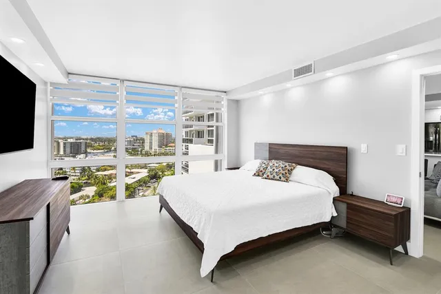a view of a swimming pool with outdoor seating