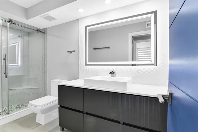 a view of wooden door and a window