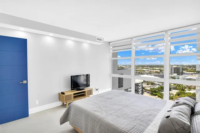 a view of a living room and kitchen