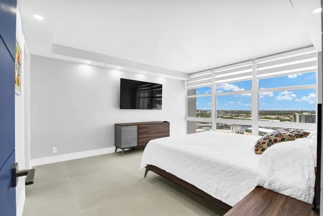 a lobby with furniture and a large window