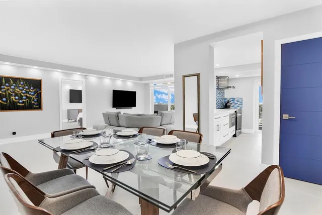 a kitchen with stainless steel appliances a sink and a stove