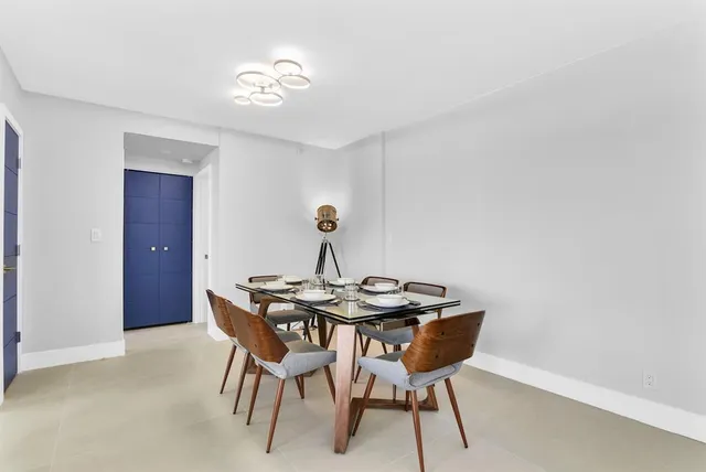a kitchen with a sink and a stove top oven