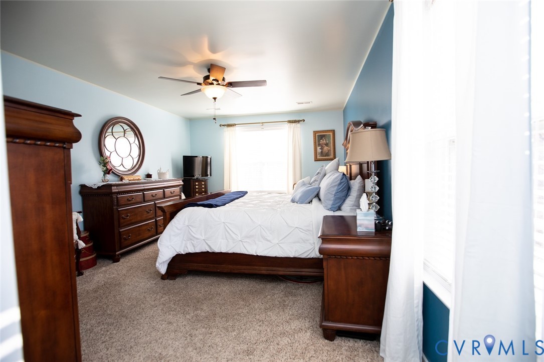 110 Jesse's Way Farmville, VA 23901 - Photo 27 of 56 a bed room with a bed and a chandelier